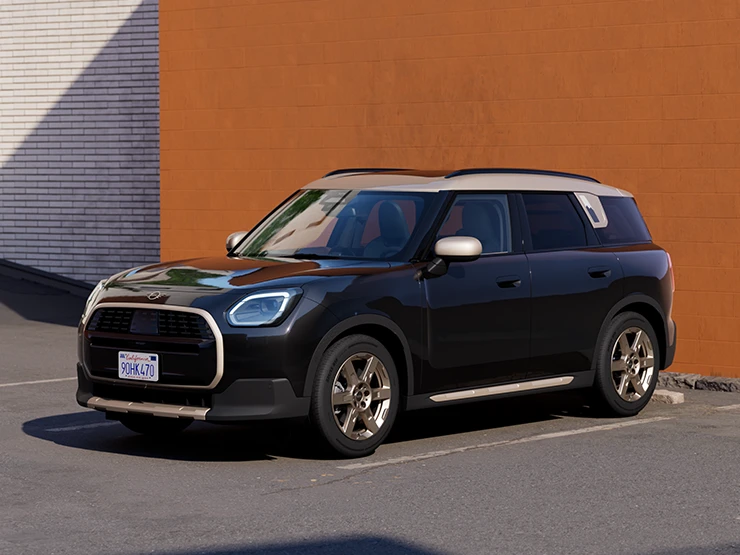 Sivukuva edestä MINI Countrymanista Midnight Black -värissä ja Vibrant Silver -katolla, pysäköitynä.